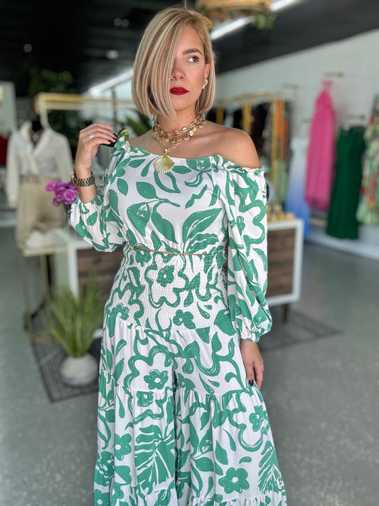 Off-shoulder maxi dress set with green-and-white botanical print and ruffled tiers.