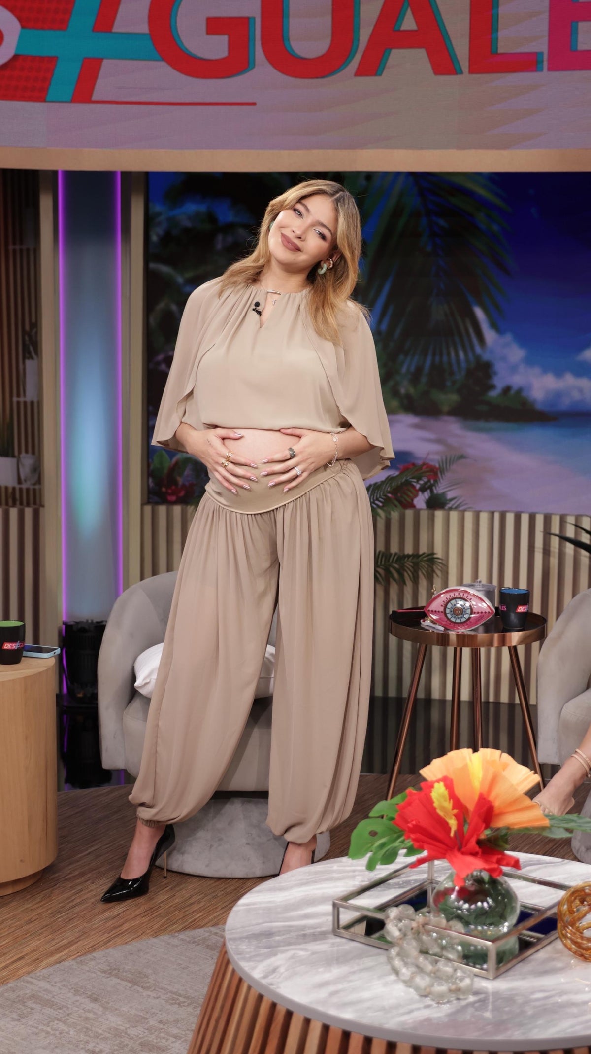 Beige blouse and wide-leg pants set with relaxed three-quarter sleeves.