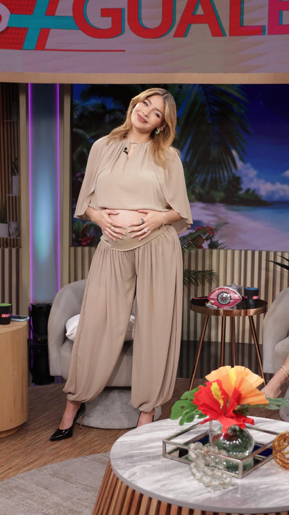 Beige blouse and wide-leg pants set with relaxed three-quarter sleeves.