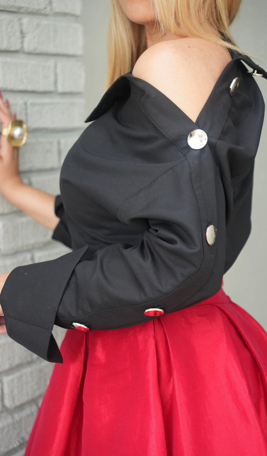 Black Selena top, off-shoulder with crossed neckline, gold snap at shoulder