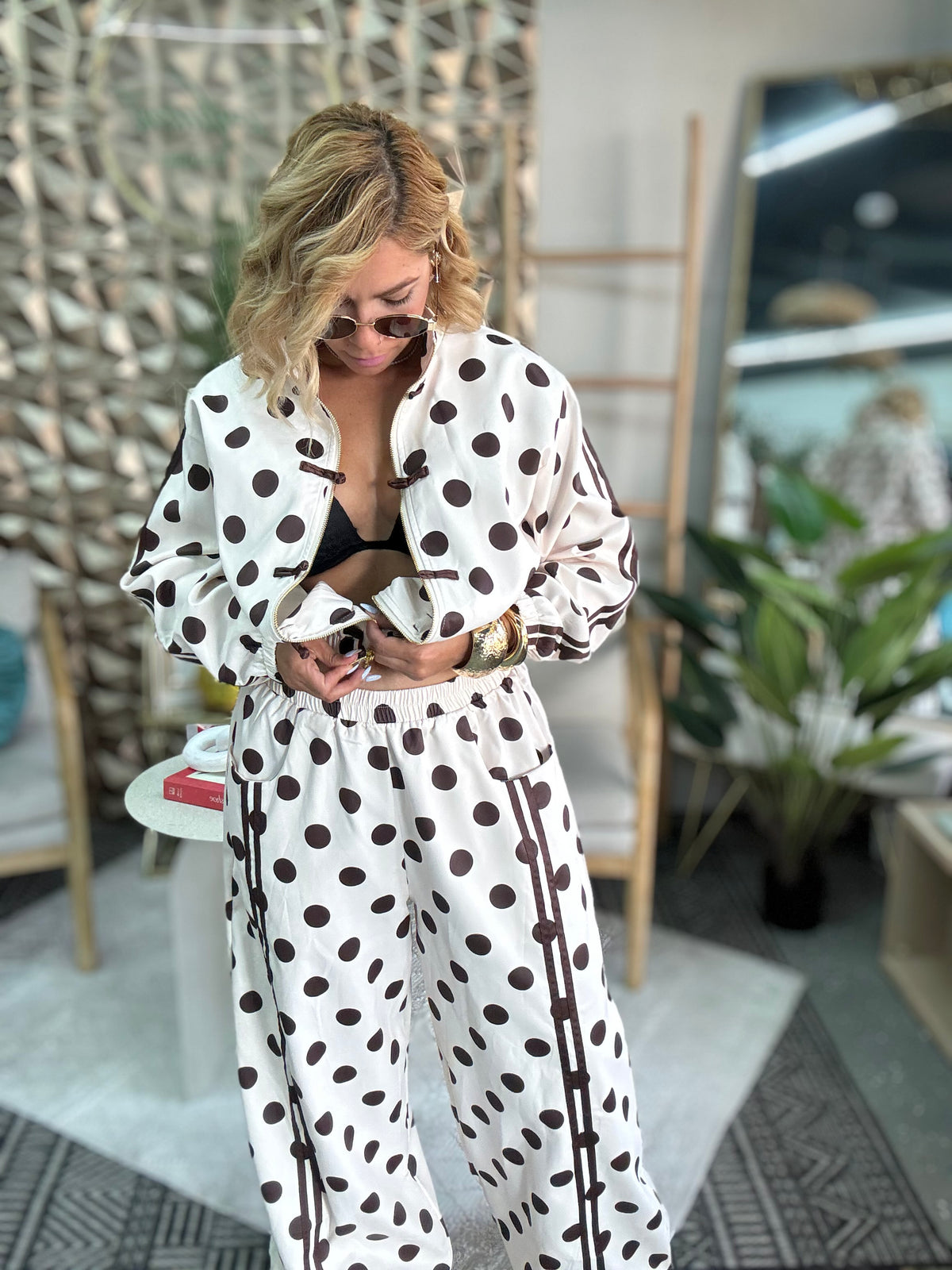 Women’s polka-dot travel set jacket and pants, white base with dark dot pattern