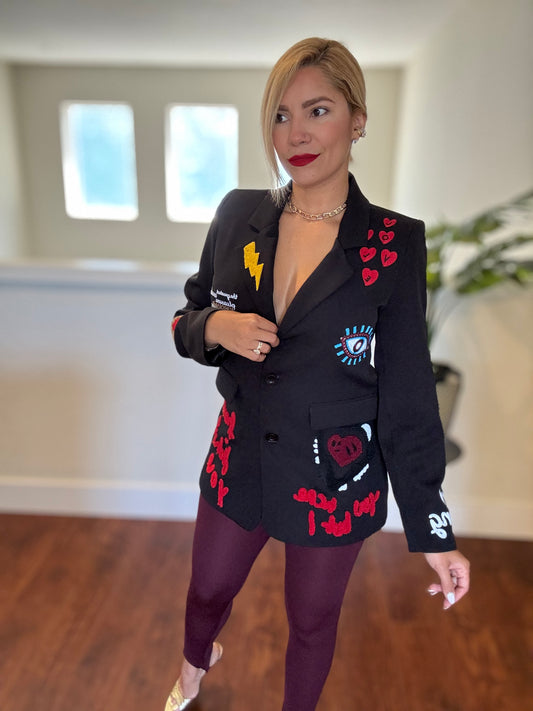 Black blazer with colorful emblem patches and notch lapels