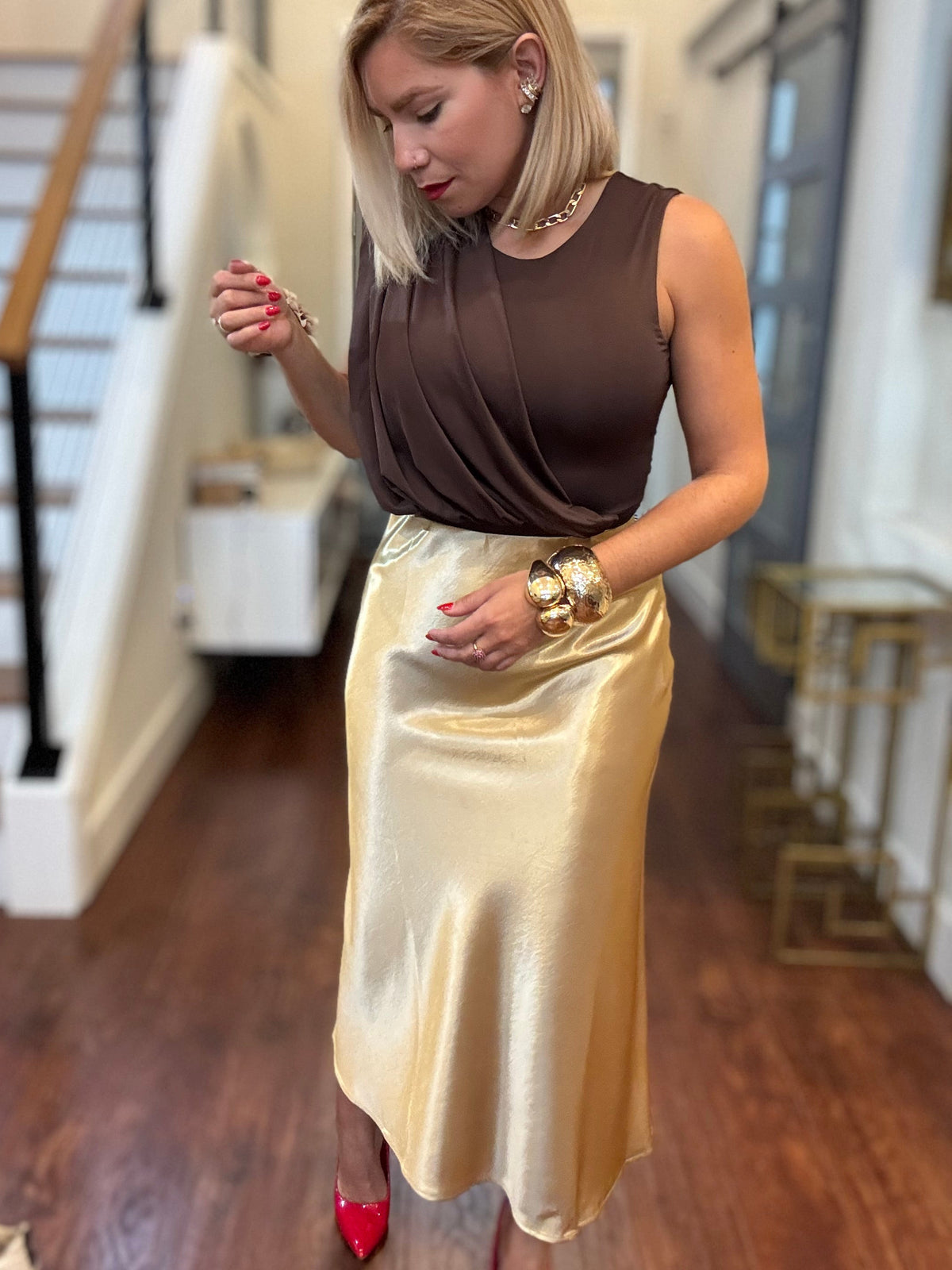 Gold satin midi skirt with glossy finish and straight, fitted look