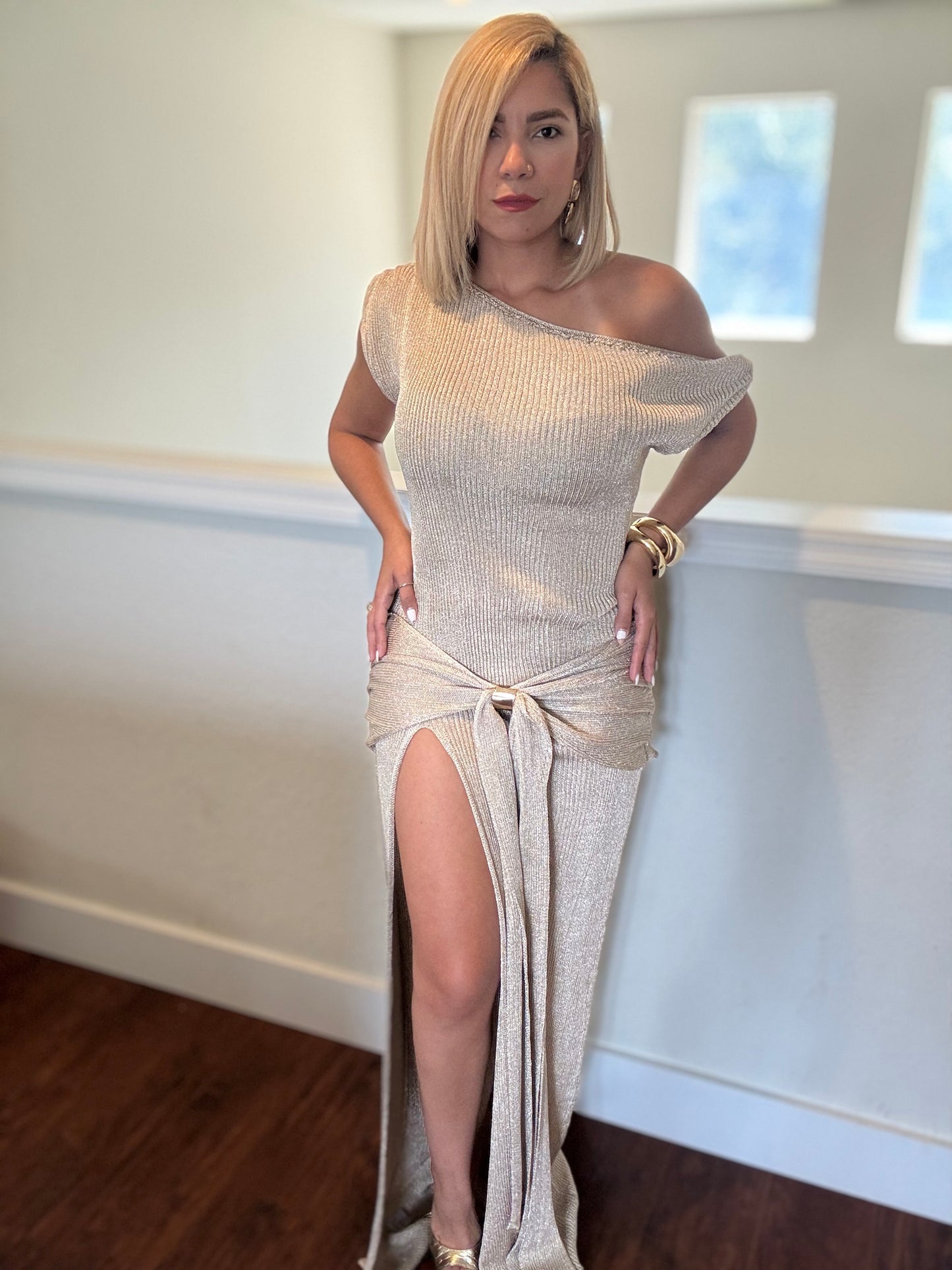Gold one-shoulder glitter maxi dress with side slit and long tied waist sash