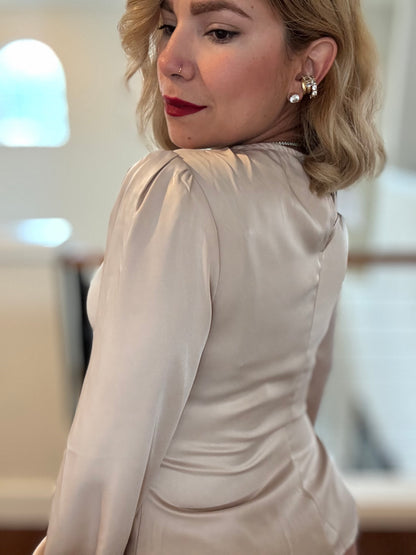 Beige satin top with puff sleeves and ruched waist, gathered shoulder detail