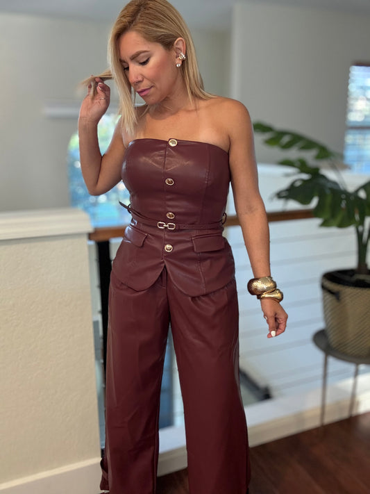 Burgundy strapless jumpsuit with cargo-style pockets and gold-tone closures