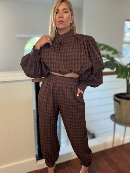 Brown plaid top with high collar and drawstring-waist jogger pants
