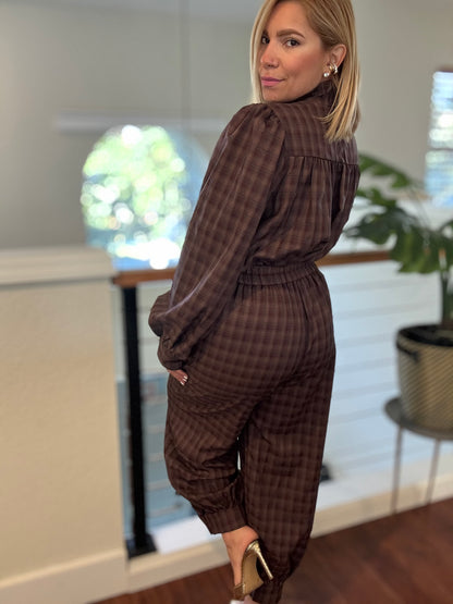 Brown plaid button-front top and jogger pants shown from a side angle