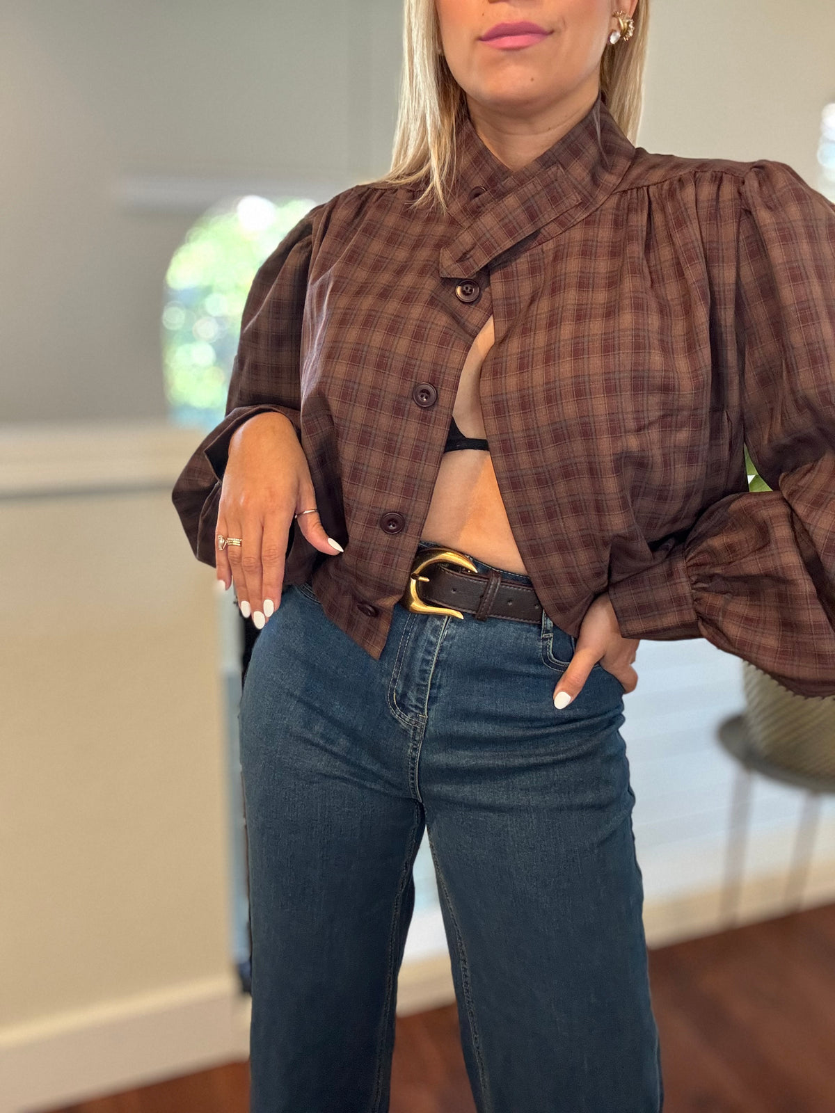 Blue jeans close-up with front patch pockets, belt loops, and zip front