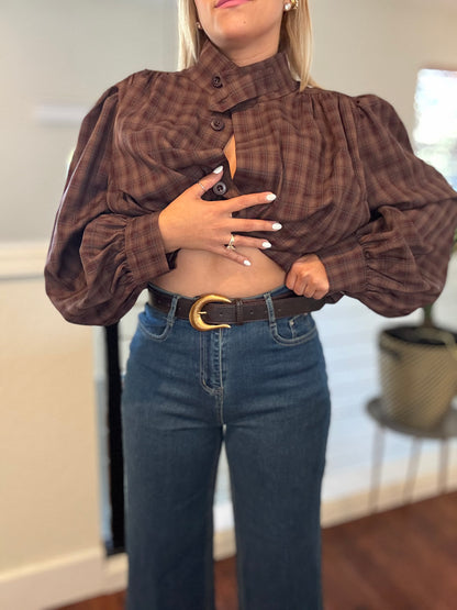 Front view of blue jeans with belt loops, button-and-zip fly, and pocket seams